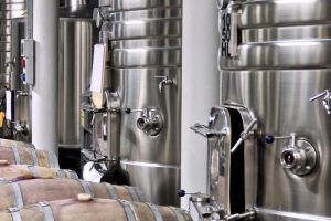 How do breweries control and manage carbon dioxide (CO2)?